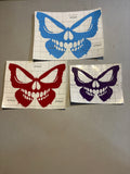 Butterfly skull design shown in blue, red, and purple
